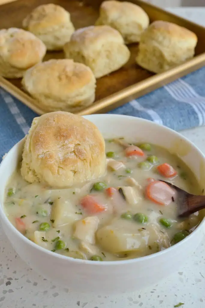 This Creamy Chicken Pot Pie Soup is comfort food at its best, topped with fresh biscuits. 