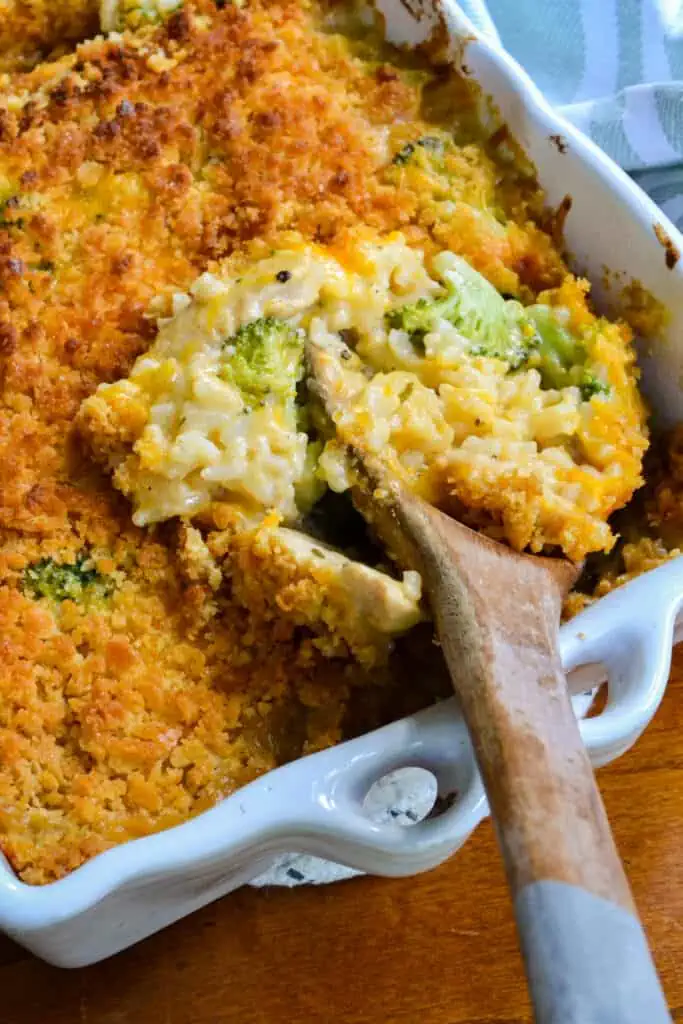 Scrumptious Chicken Broccoli Rice Casserole brings caramelized onions, sweet garlic, and sautéed chicken together with long grain rice and steamed fresh broccoli in a creamy cheddar cheese sauce, all topped with a buttery cracker topping.  