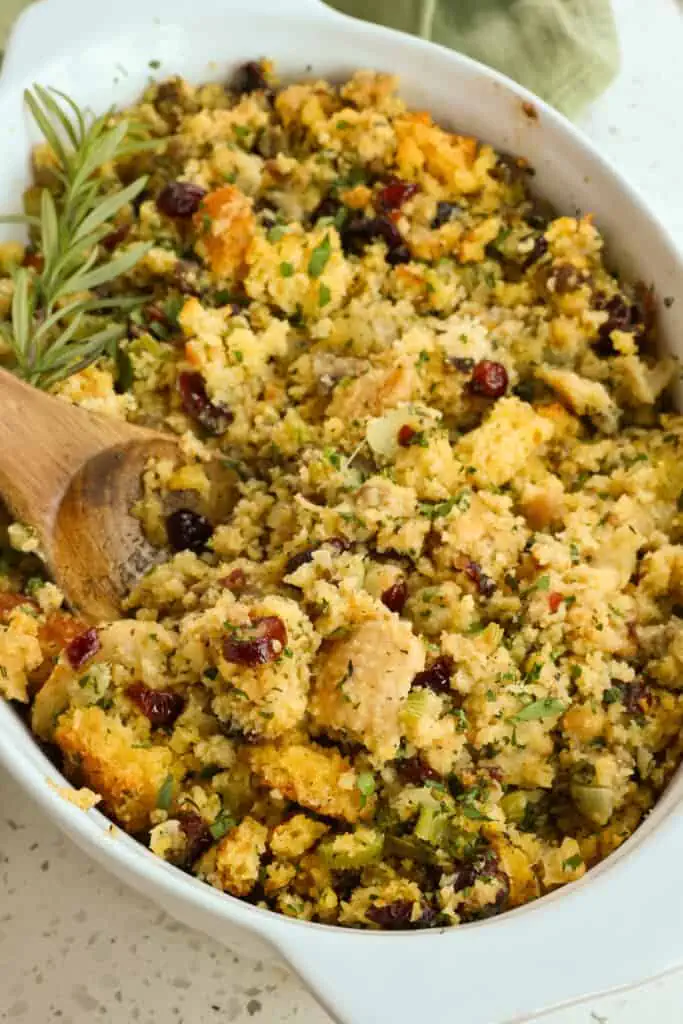 Classic Southern Cornbread Dressing made with homemade cornbread, ground sausage, onions, celery, dried cranberries, and plenty of fresh herbs. 