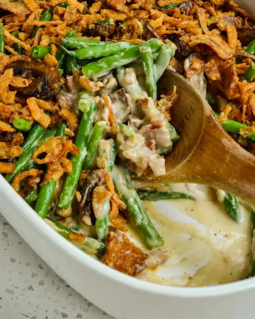 Are you tired of the same old green bean casserole? This semi-homemade Green Bean Casserole is made with fresh green beans and a made-from-scratch homemade creamy mushroom sauce, all topped with crispy onions.