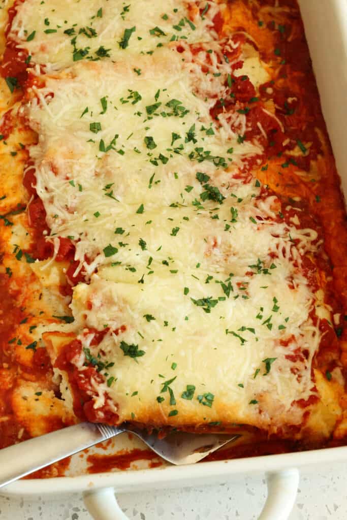 This Roasted Garlic Three Cheese Stuffed Manicotti are filled with ricotta, mozzarella, Parmesan, and fresh roasted garlic.
