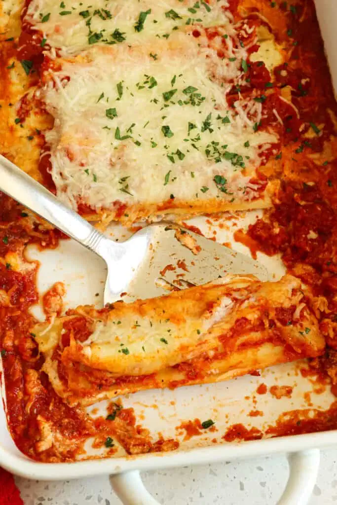 A super easy and fun three cheese and garlic stuffed manicotti that can prepped up to two days in advance for busy families.