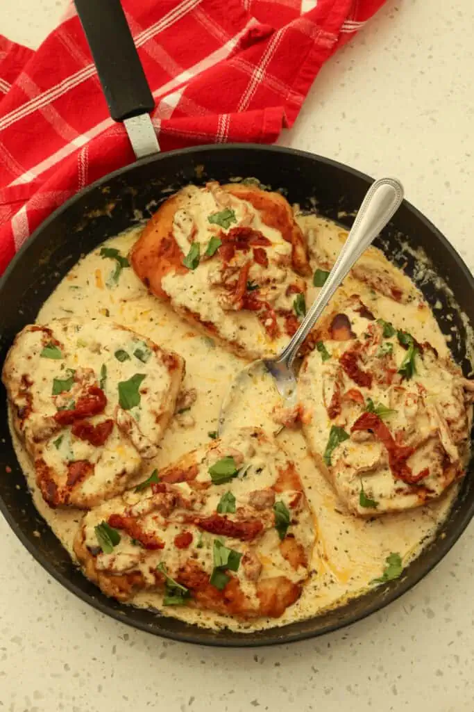 This tasty Marry Me Chicken combines lightly breaded browned chicken breasts with garlic and sun-dried tomatoes in a rich and creamy Parmesan Sauce.  
