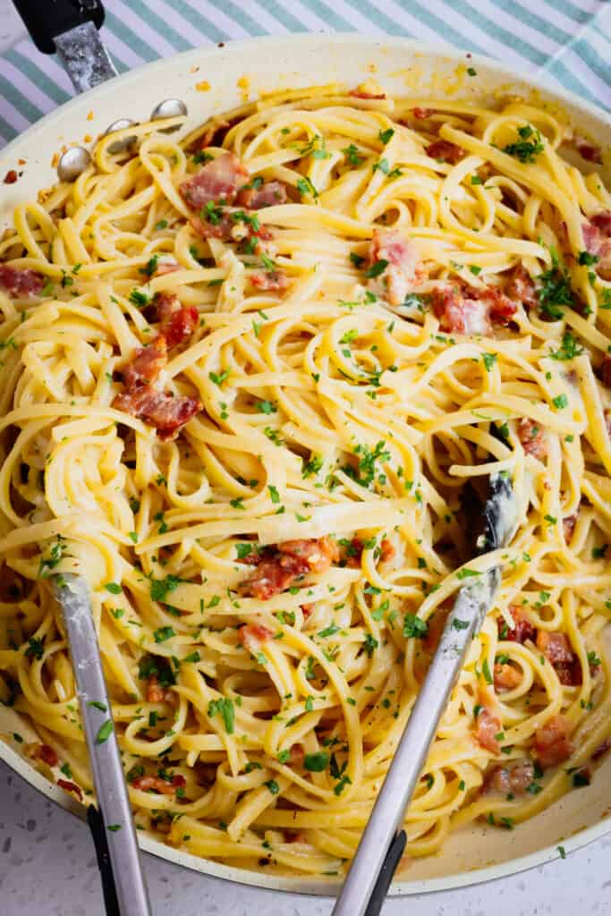 Pasta Carbonara is a unique and easy pasta dish that combines linguine or spaghetti with crisp pan fried bacon in a creamy Parmesan Sauce.