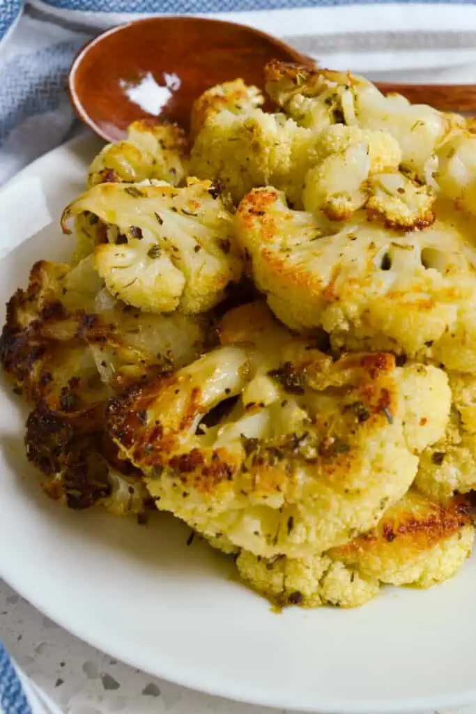 A heart-healthy, easy roasted cauliflower side dish made with wholesome ingredients like olive oil, Parmesan cheese, dried herbs, and spices.