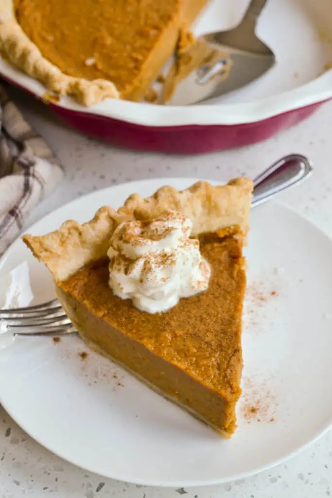 A Sweet Potato Pie made with a flaky buttery crust brimming with a creamy sweet potato filling with cinnamon and ginger.