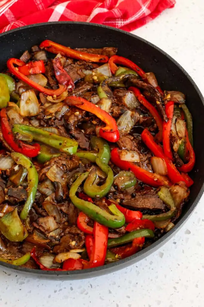 Add the veggies and beef back to the skillet. Stir to warm and coat everything. 