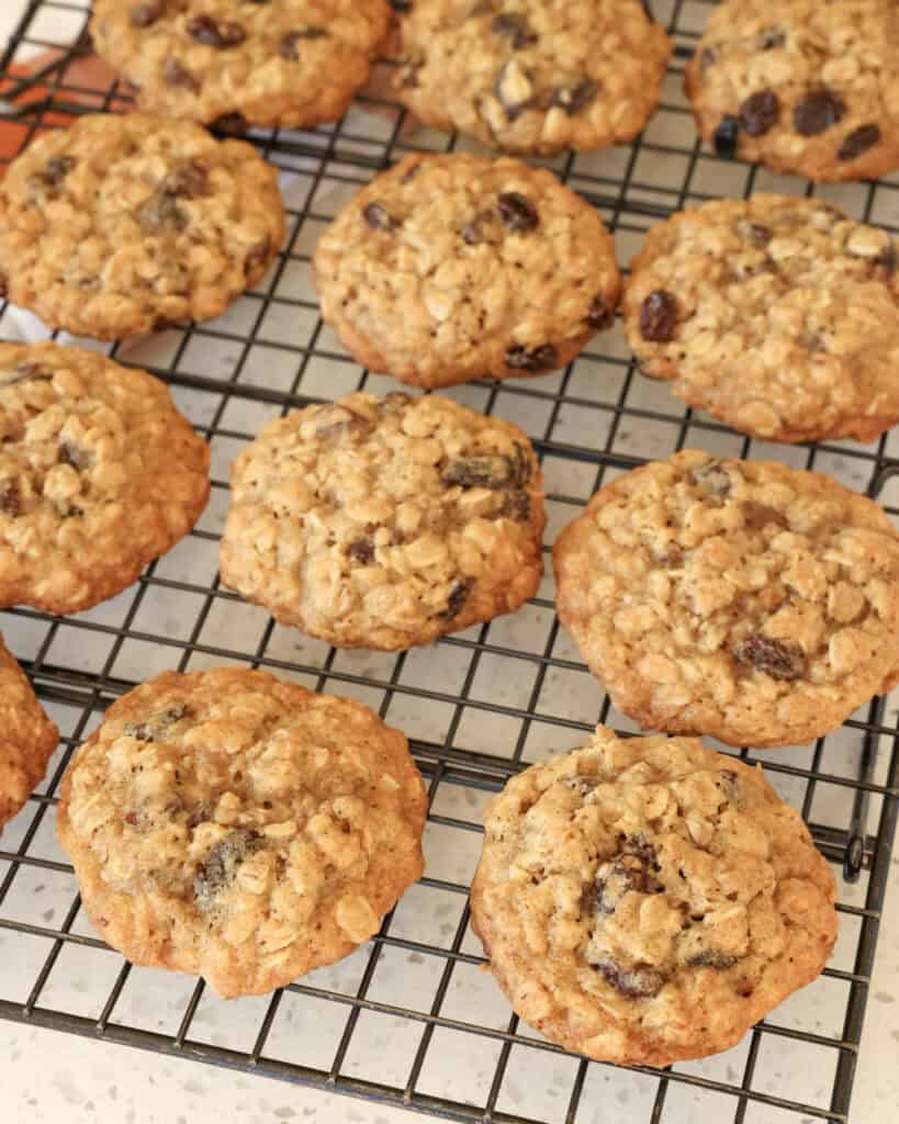 Oatmeal Raisin Cookie Recipe Oatmeal raisin cookies on a cooling rack.