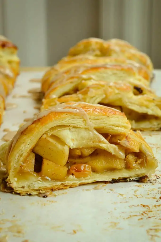 This Apple Strudel is made with flaky puff pastry, crisp apples, plump raisins all drizzled with a sweet cinnamon glaze.