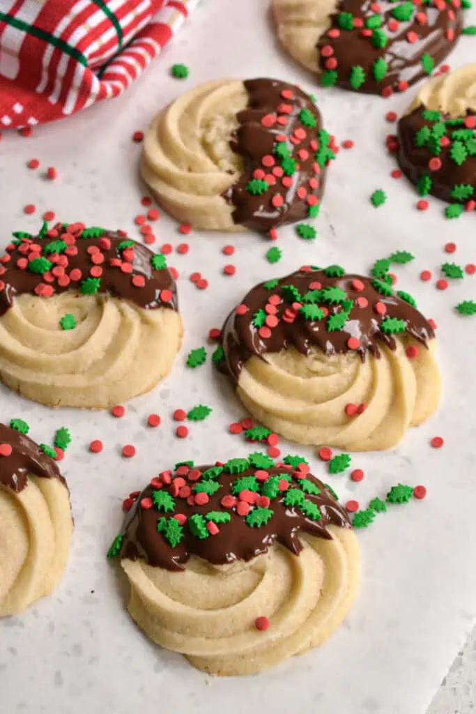 Once completely cool, dunk in melted white or semisweet chocolate.  Then, place them on parchment paper so they won't stick and dust with assorted sprinkles.