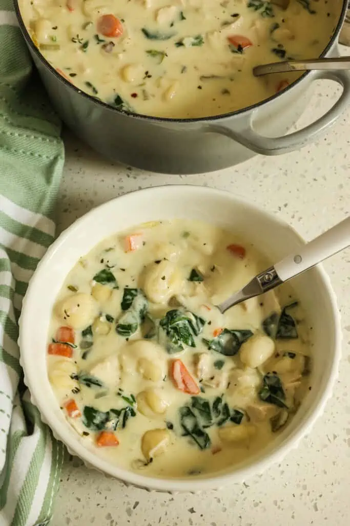 Chicken Gnocchi Soup combines gnocchi, onions, celery, carrots, spinach, and chicken into a creamy broth. 
