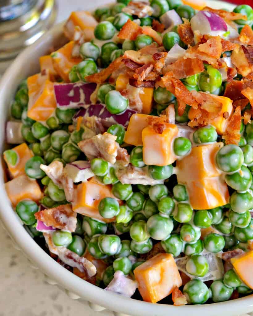This delectable creamy pea salad comes together in less than ten minutes and is a favorite at family reunions, potlucks and picnics.