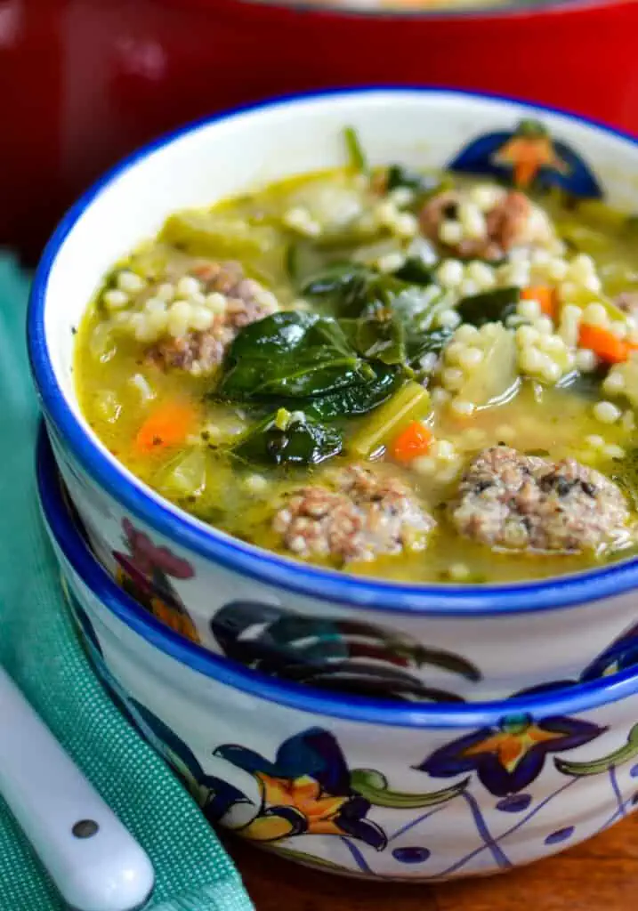 An easy soup made with delicious pork and beef meatballs, onions, carrots, celery, garlic, spinach, and acini di pepe pasta, all simmered in a lightly seasoned broth.