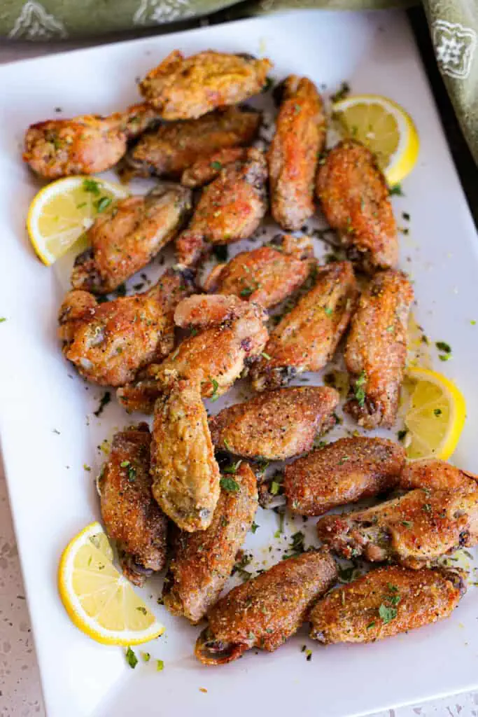  These party-perfect wings are cooked to golden brown perfection, without deep frying, and then slathered in a lemon pepper honey butter sauce for the ultimate wing experience.