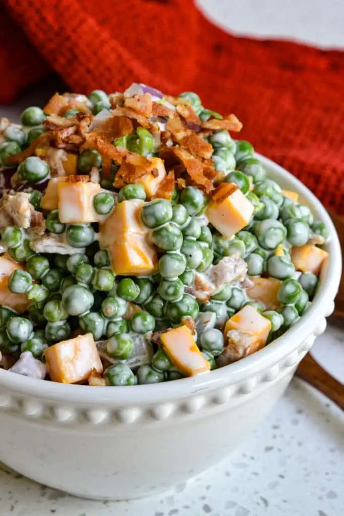 Creamy Pea Salad comes together in less than ten minutes and it is a favorite at family reunions, potlucks and picnics.  