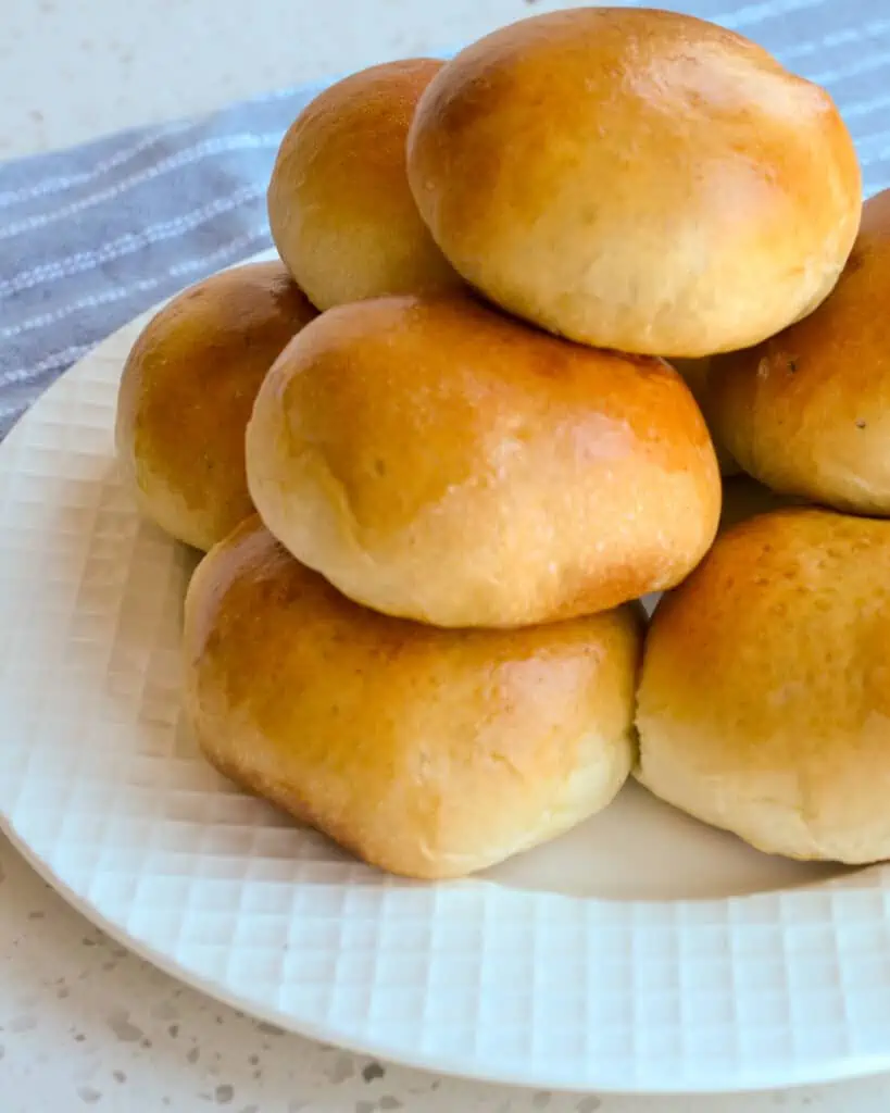 Runzas stacked ona white serving  plate. 