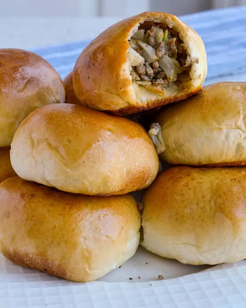 This Runza Recipe is made with already prepared frozen bread dough and browned ground beef mixed with onion and green cabbage and seasoned with salt and fresh ground black pepper.