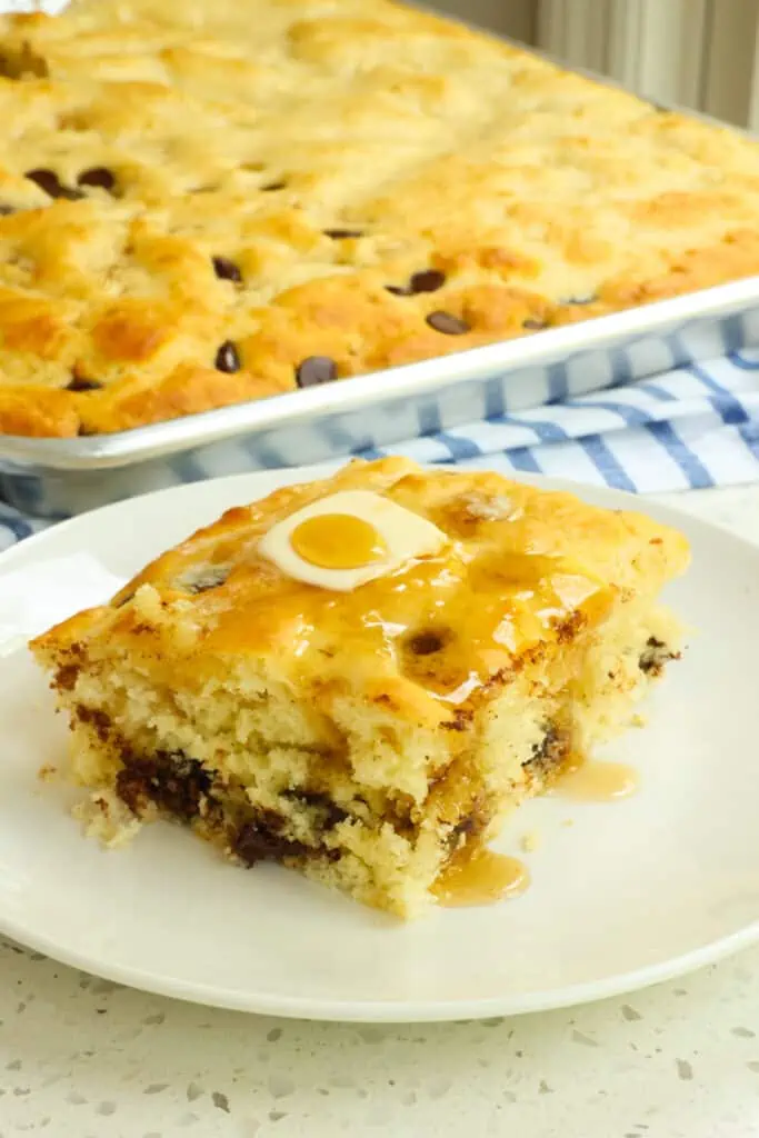 These quick and easy Sheet Pan Pancakes with homemade pancake batter, blueberries, and chocolate chips are the perfect answer for making pancakes for a crowd. 