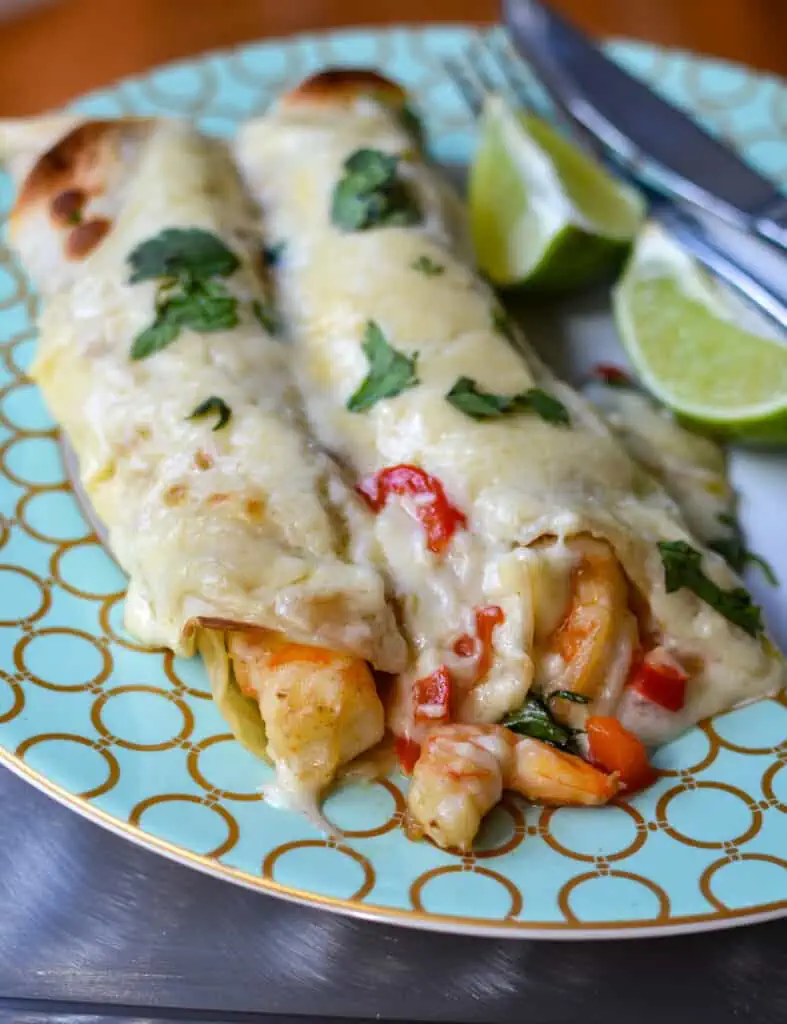 Easy Creamy Shrimp Enchiladas are a shrimp lover's dream and really only require about 30 minutes, making them easy enough for a weeknight dinner. 