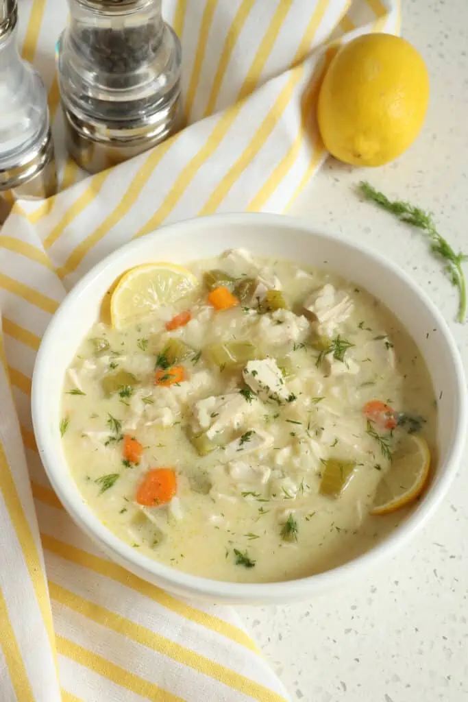 This Avgolemono Soup, also known as Greek Lemon Soup, brings chicken, onions, celery, carrots, garlic, and Arborio Rice together in a creamy lemon chicken broth seasoned with fresh dill. 