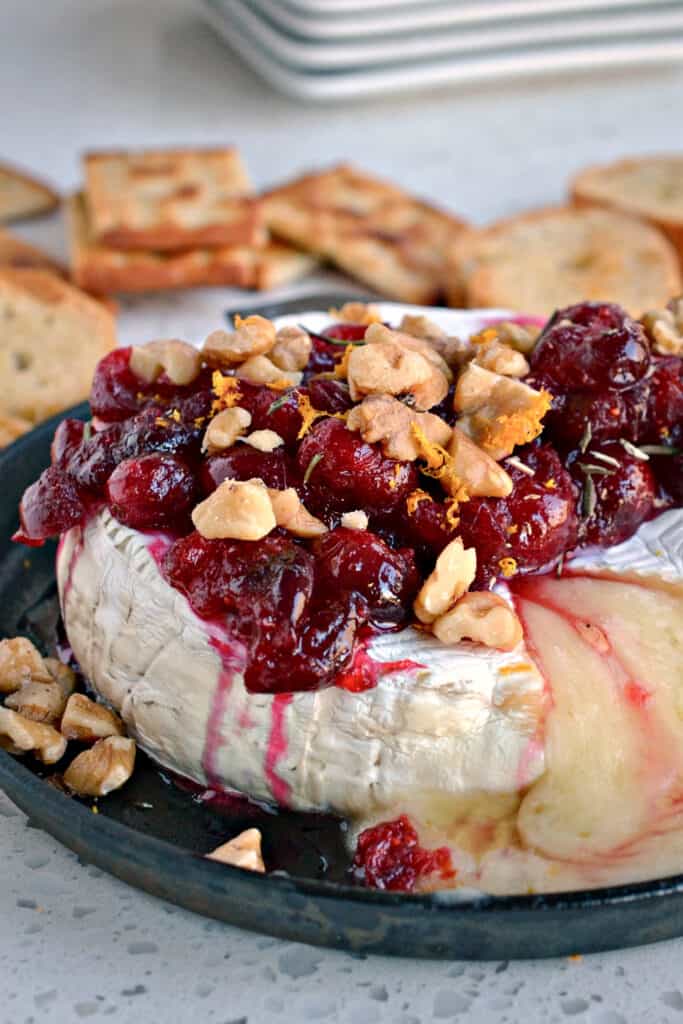 This Baked Brie with cranberries, walnuts, rosemary and honey is easy, elegant and flavorful. 