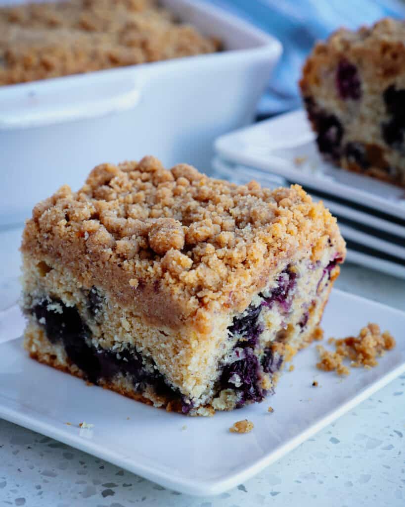 Blueberry buckle coffee cake is a delicious vanilla butter cake loaded with fresh blueberry flavor and topped with a sweet cinnamon streusel topping.  It is just heavenly, with juicy blueberries in every bite.