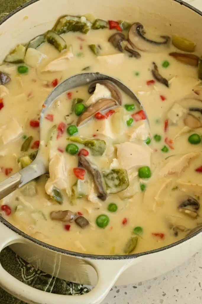 Chicken a la king is a hearty, creamy dish with chicken, peas, peppers, mushrooms, and pimentos. Serve over a bed of rice or flaky biscuits for a rich and satisfying dinner.