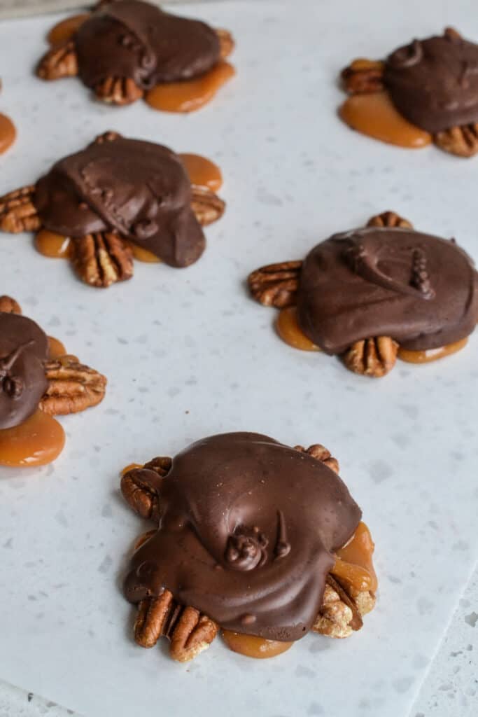 These homemade Chocolate Turtles are pecan clusters covered with chewy caramel and a layer of rich chocolate.