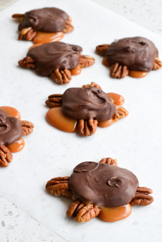 Chocolate Pecan Turtle Clusters Recipe Delicious Homemade Turtles candies are made super easy using microwave caramel. Perfect for parties, holiday gift giving, and hostess presents.
