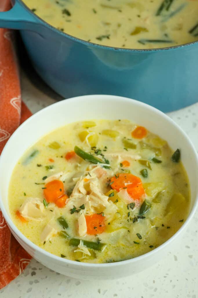 Creamy Chicken Soup is made with onions, celery, carrots, potatoes, and green beans, all in a rich and velvety broth seasoned with fresh thyme.