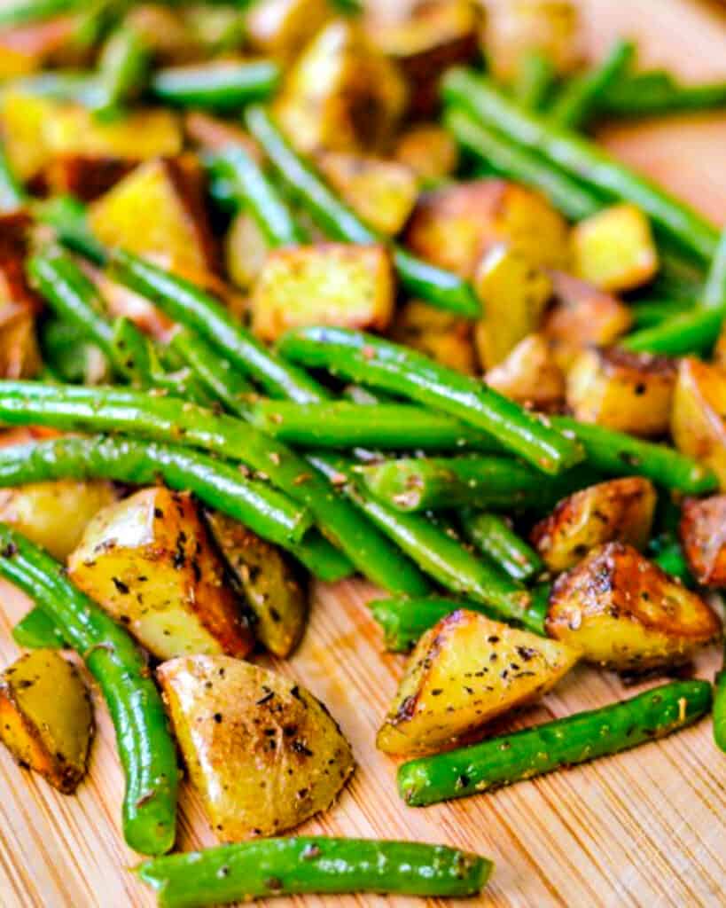 Green Beans and Potatoes are crisp tender green beans and perfectly seasoned spuds fried in a little butter, all seasoned with salt and pepper. 