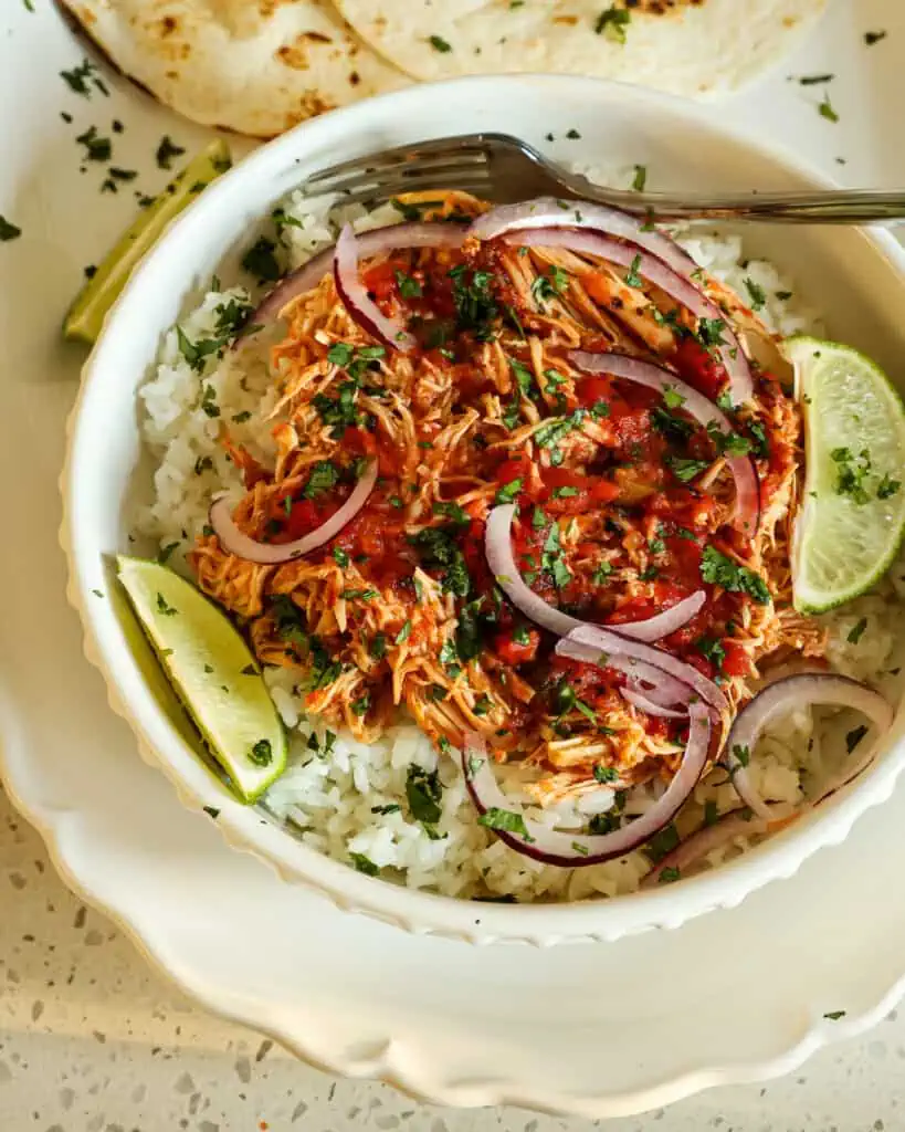 Use the tender salsachicken in bowls, burritos, tacos, and quesadillas. Serve over Cilantro Rice with thin slices of red onion and lime wedges. 