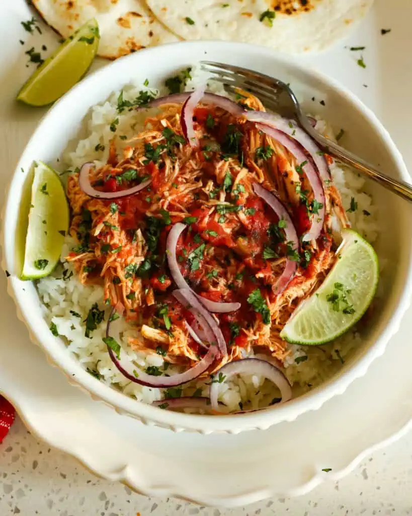 A delicious Salsa Chicken Recipe made easy in a slow cooker with just four simple ingredients.