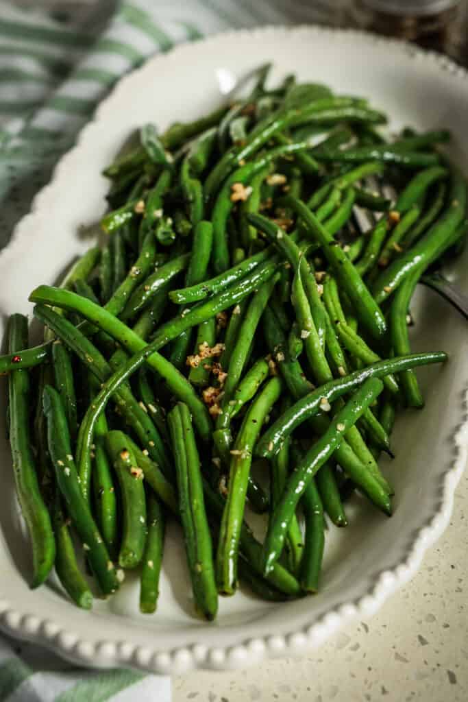 This delicious side dish can be prepared with any green beans, but I particularly like the haricots verts, also known as French green beans. They are longer, more slender, and more tender than regular green beans.