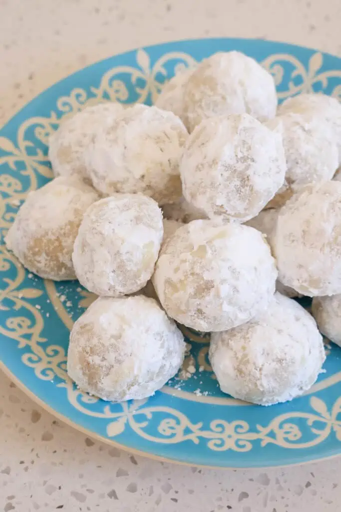 You might know these cookies as Russian Tea Cakes, Italian Wedding cookies, butter balls, and Mexican Wedding Cookies, but in our house, we just call them Snowballs. 
