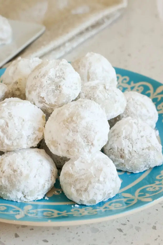 These melt in your mouth buttery pecan shortbread cookies are baked to perfection and rolled in powdered sugar.