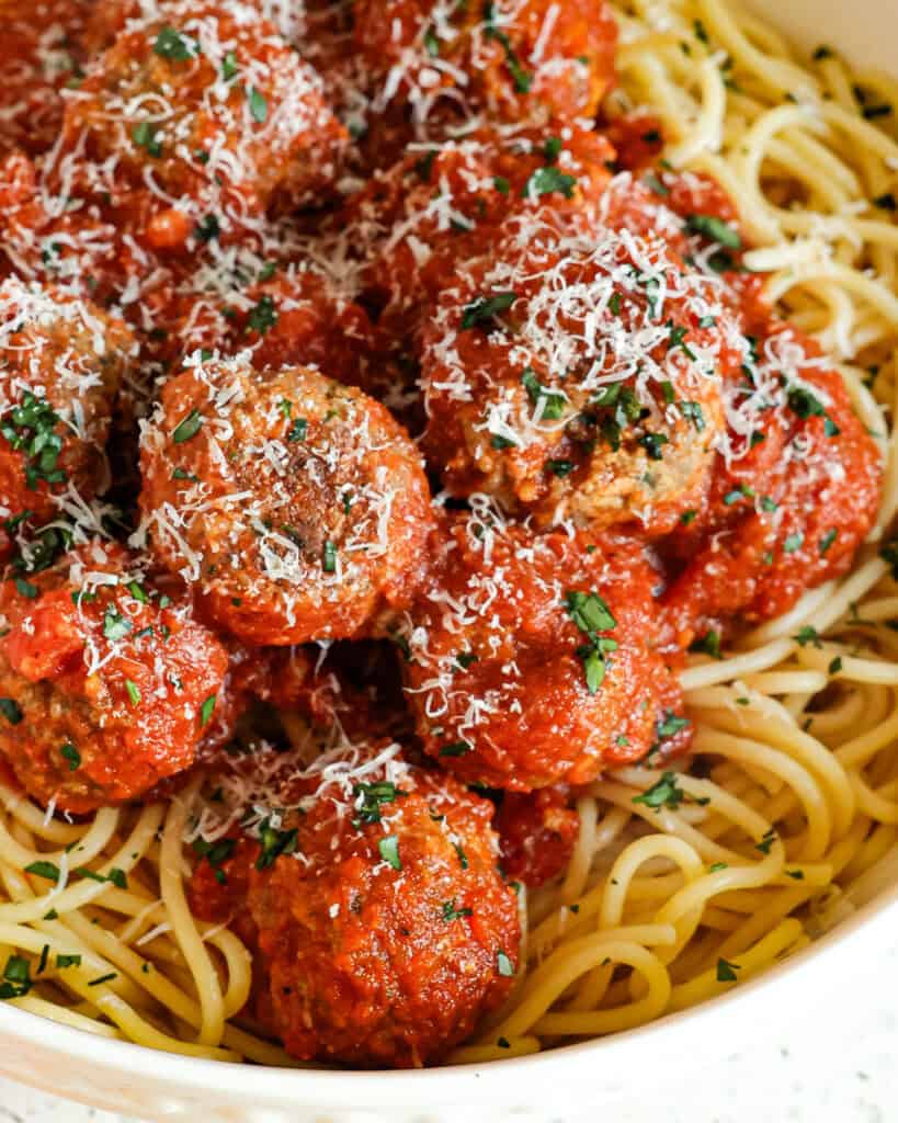 A close up view of spaghetti and meatballs.