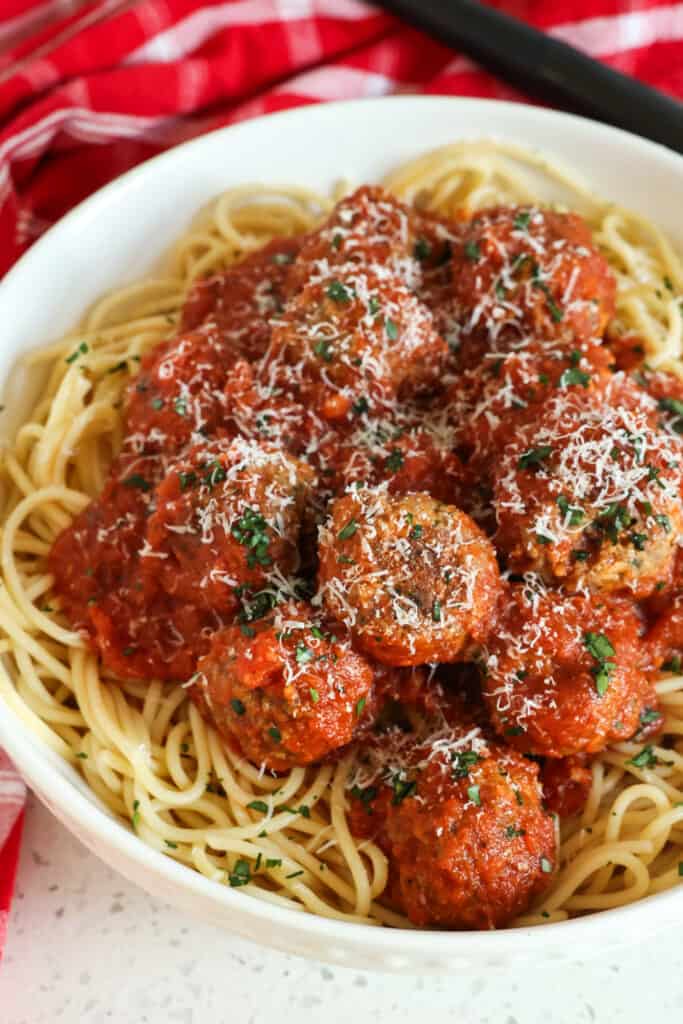 This homemade Spaghetti and Meatballs recipe combines tender, juicy meatballs with a made from scratch six-ingredient marinara sauce. 
