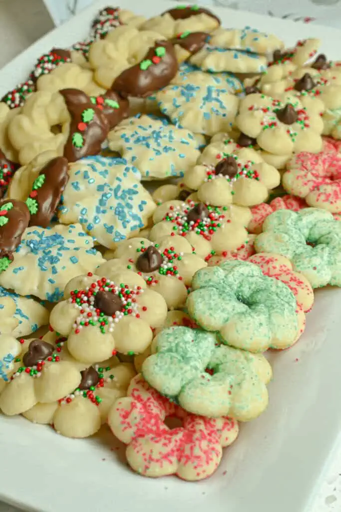 Spritz Cookies are tiny cookies that are similar to butter cookies and sugar cookies. They are formed using a cookie press.  