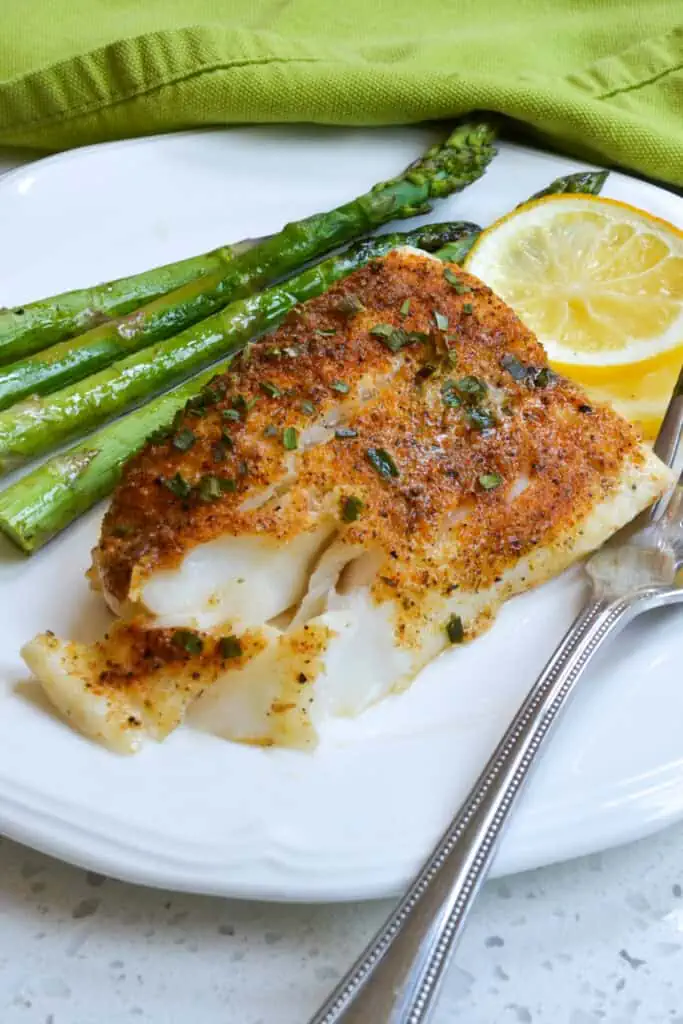 This delicious Lemon Pepper Baked Cod Recipe is so simple and quick to prepare with just a handful of spices and fifteen minutes time from start to finish making it a great weeknight dinner.