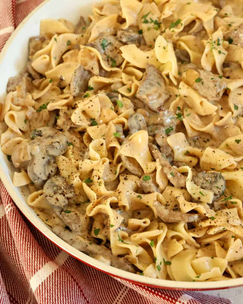 This homemade creamy Beef Stroganoff Recipe combines tender strips of beef with onions, garlic, and mushrooms in a rich, creamy, lightly seasoned beef stroganoff sauce that has a touch of mustard and sour cream in it.
