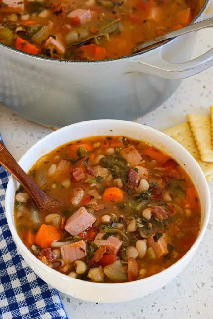 This Cajun-style Black Eyed Pea Soup is loaded with flavor from bacon, ham, fresh garden vegetables, tomatoes, and collard greens in a simple broth with Cajun seasoning and thyme.