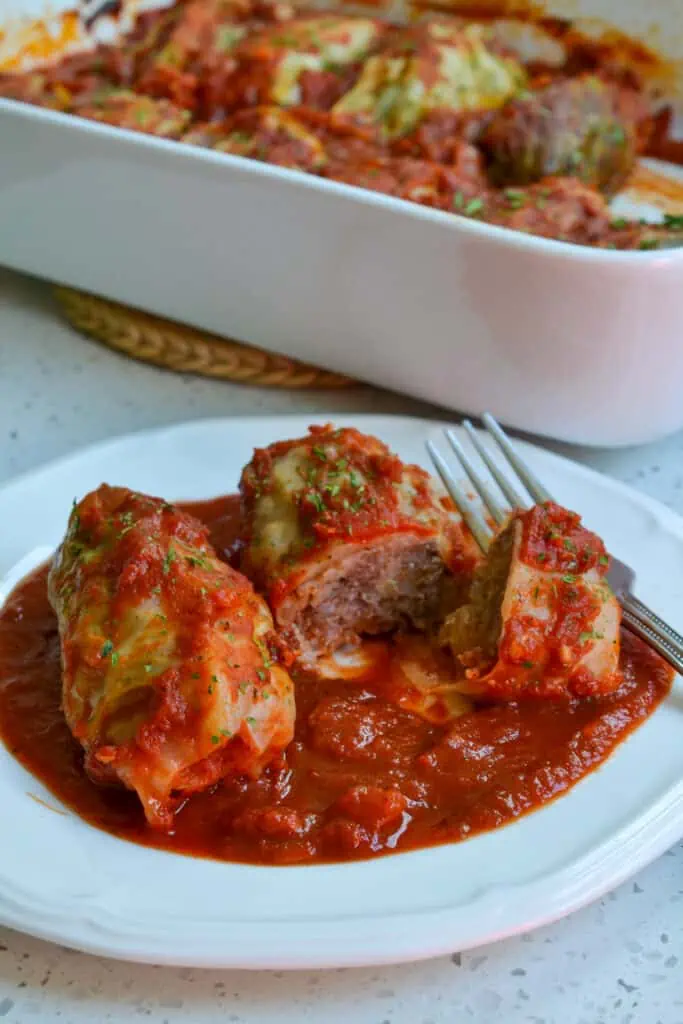 These traditional stuffed Cabbage Rolls are made with ground sausage and ground beef with a sweet and tangy tomato sauce.