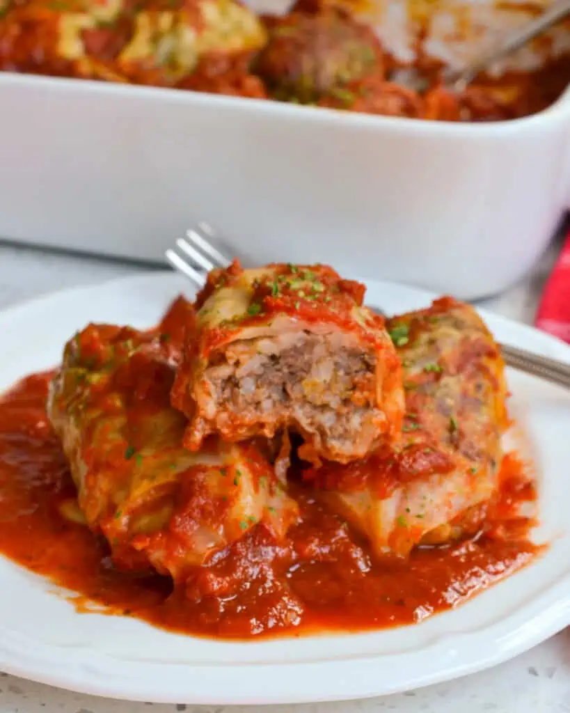 Cabbage rolls on a plate with a fork. 
