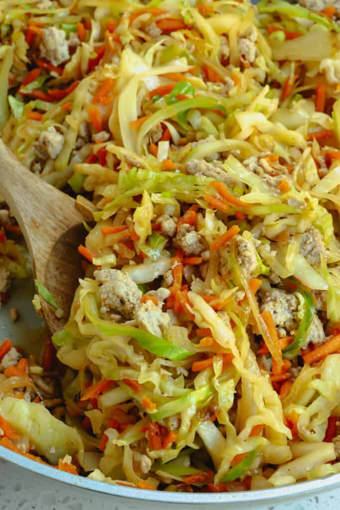 This easy skillet Cabbage Stir Fry is loaded with ground turkey, onions, cabbage, and carrots all drizzled with a six-ingredient salty sweet Asian stir fry sauce. 