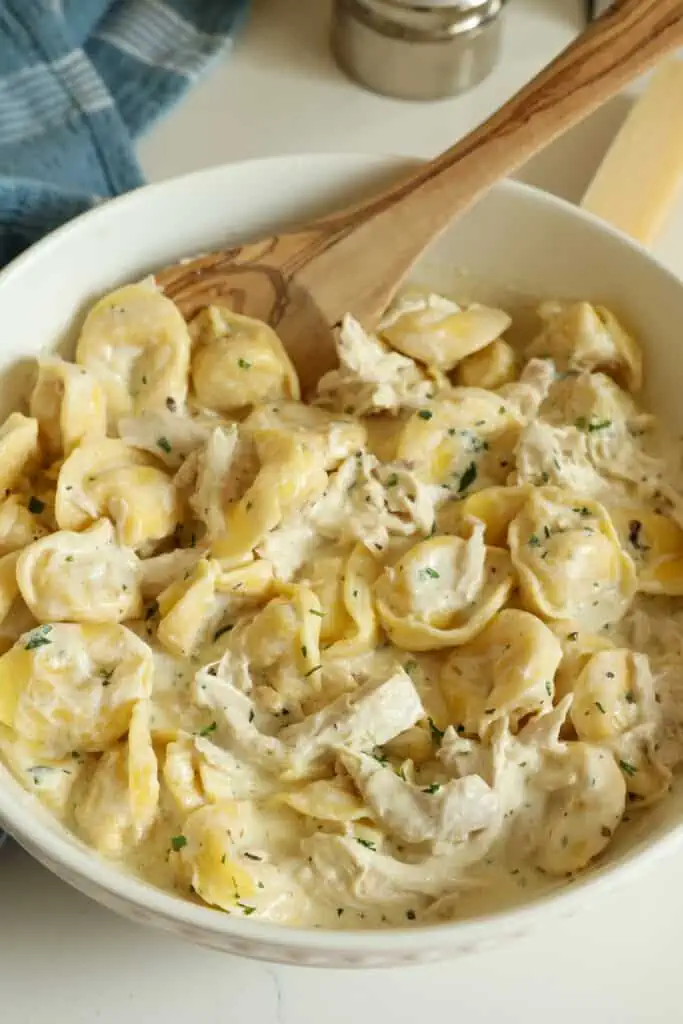 This amazing Chicken Tortellini Alfredo combines succulent rotisserie chicken with refrigerator or frozen cheese tortellini in a rich and creamy five-ingredient homemade alfredo sauce. 