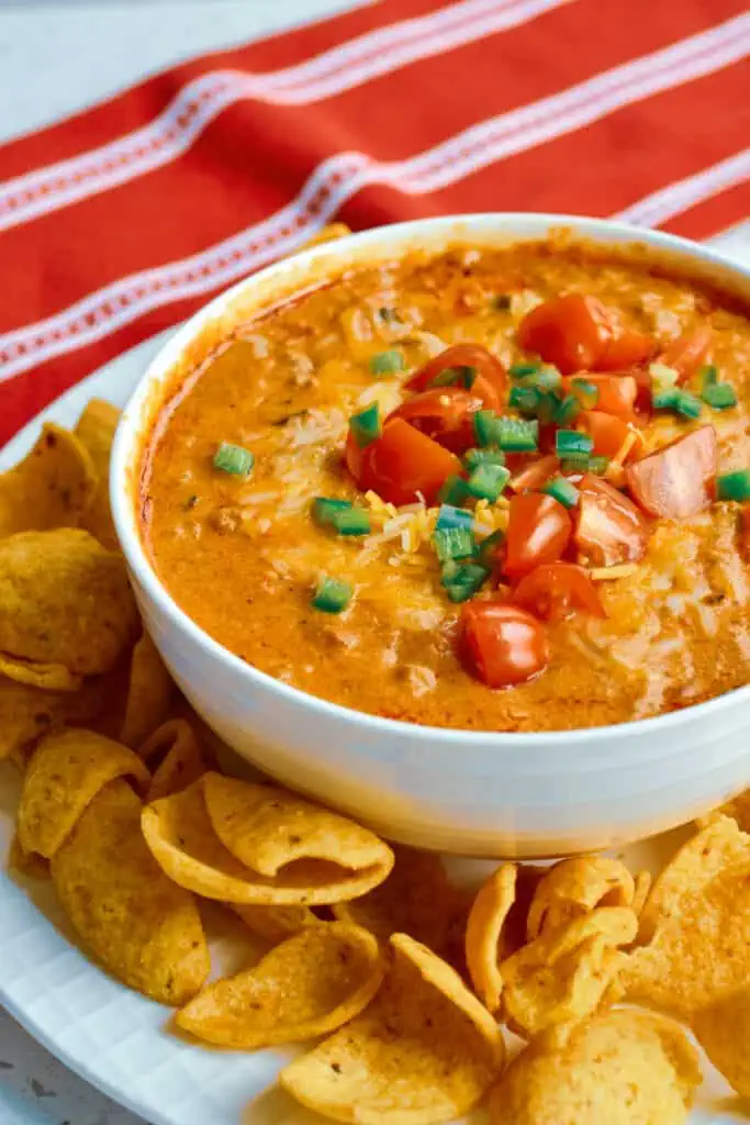 This six ingredient hot Chili Cheese Dip takes less than 15 minutes to make and can easily be adapted to a crock pot.