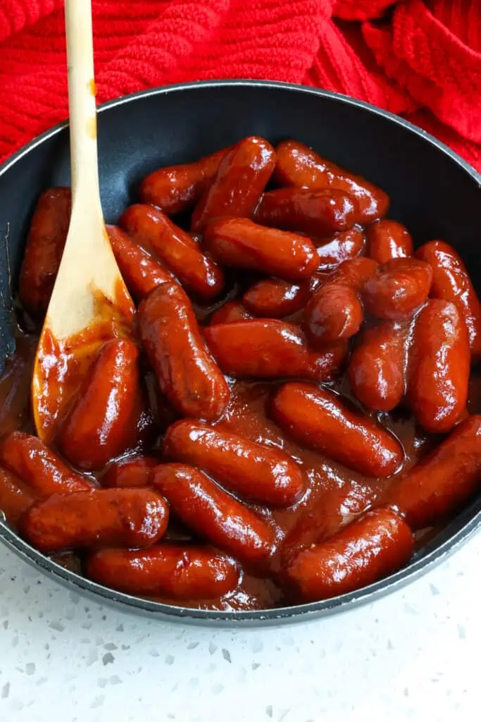 This quick and easy Little Smokies Recipe combines little smokie sausages in a sweet and tangy barbecue sauce with a hint of spice. 