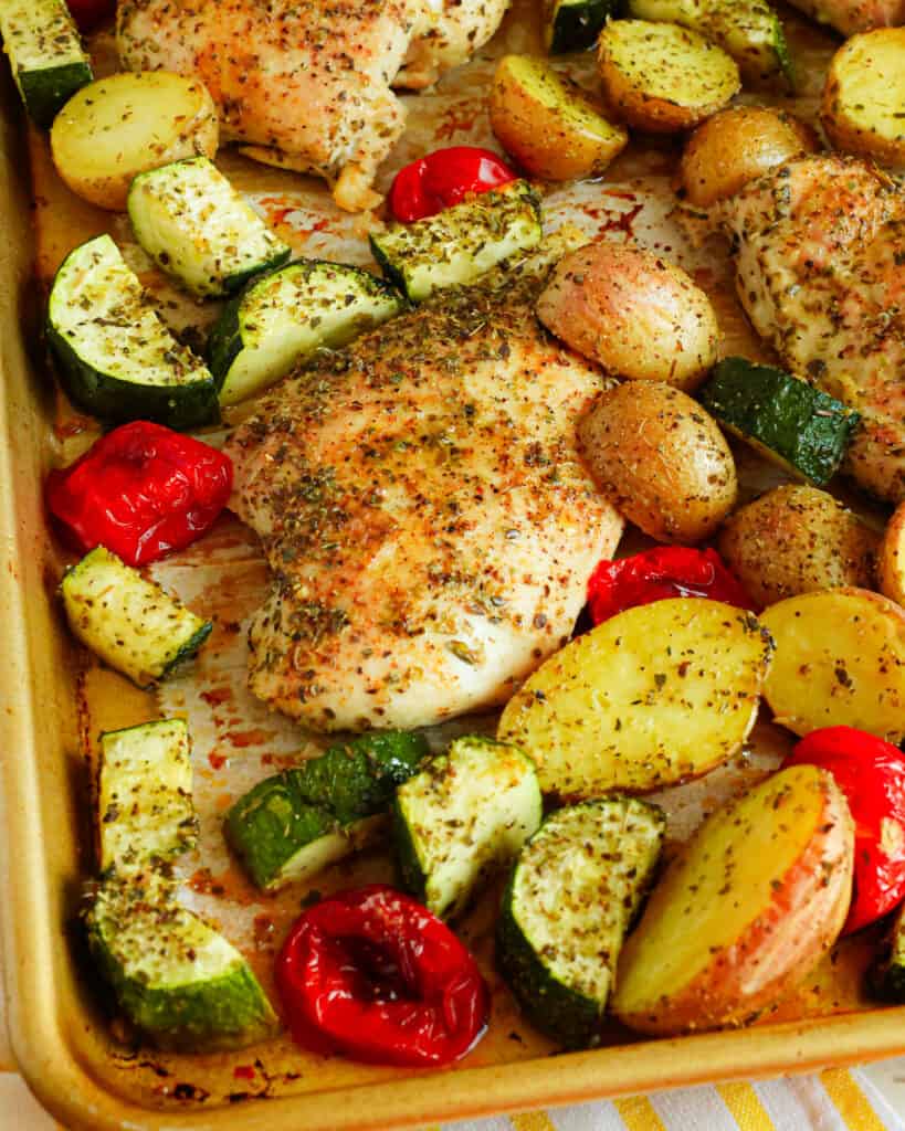 This sheet pan Italian Chicken is tender marinated chicken breasts and assorted veggies seasoned and roasted to golden perfection.