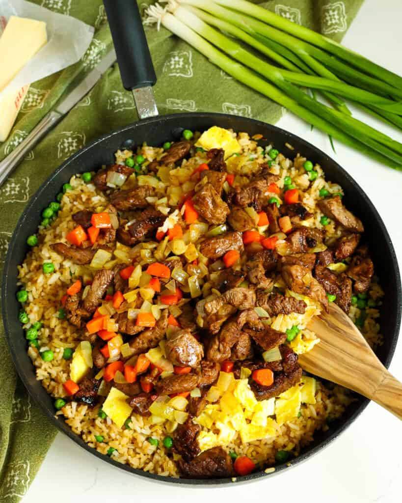 Return everything to the skillet over medium-low heat and stir to warm. Add the green onions and stir to combine. For best results sever promptly. 